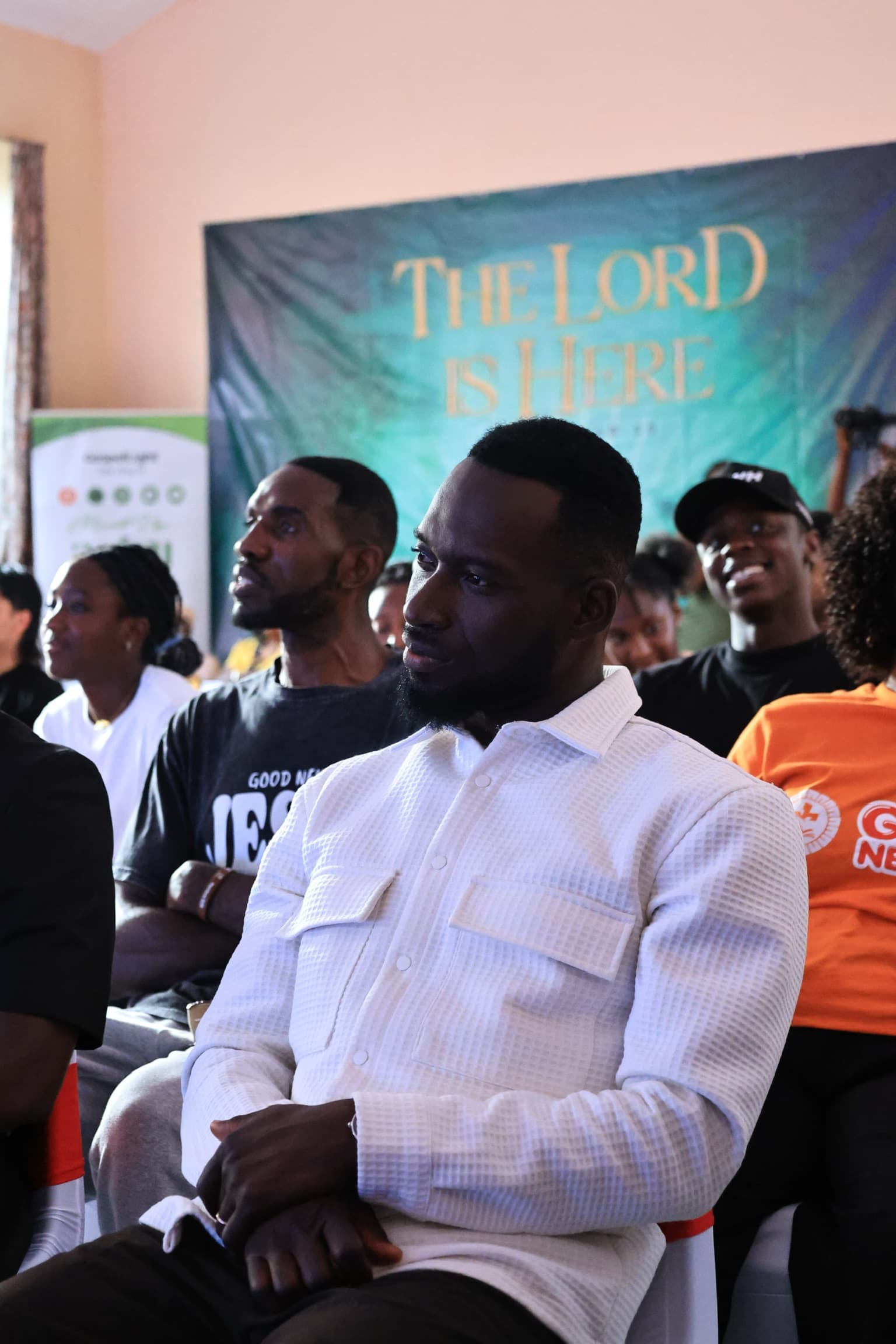 The Lord Is Here banner at a Gospel Light City Church gathering
